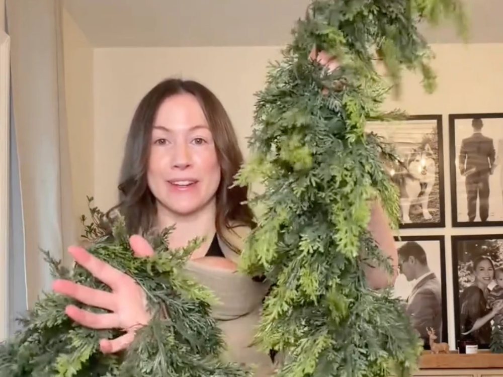 Customer holding two strands of the garland