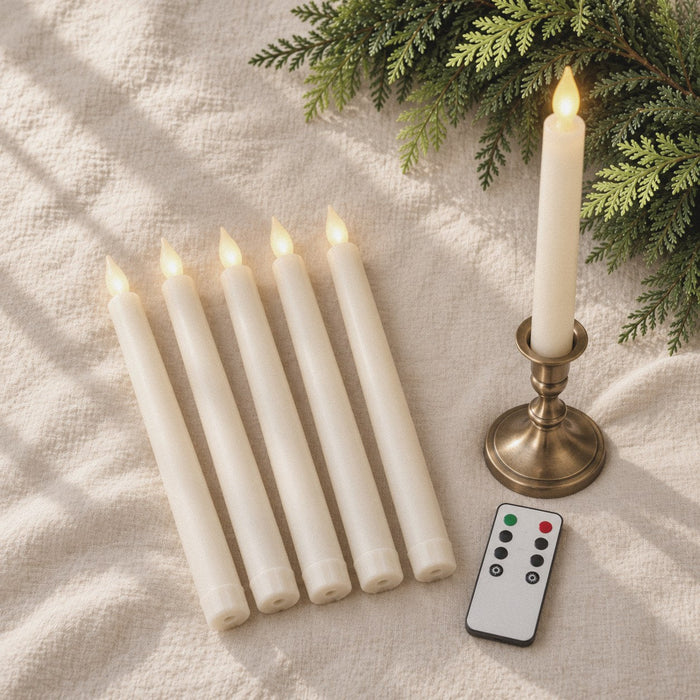 Six ivory flameless taper candles and a remote on cream linen